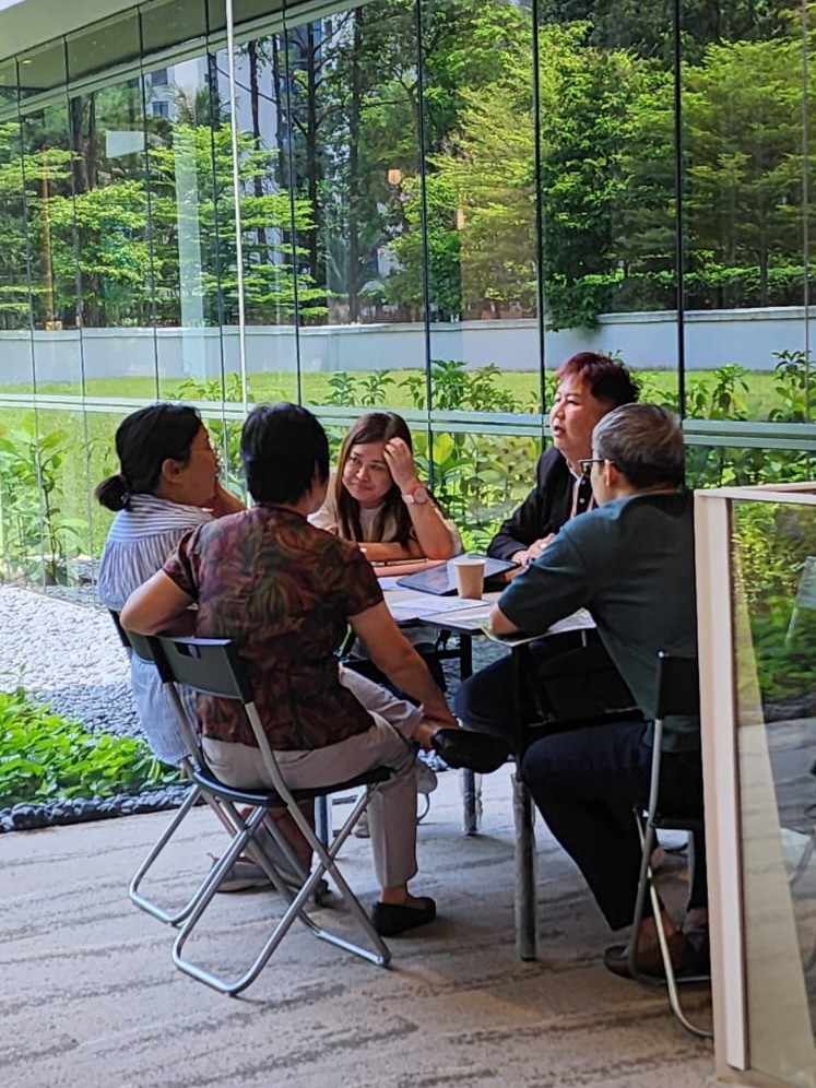 Jason doing a sales presentation in The LakeGarden Residences showflat